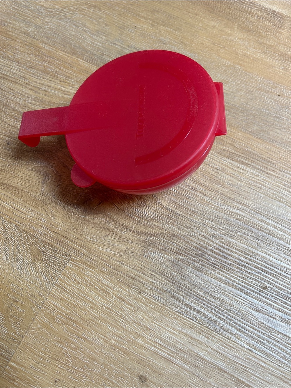 Vintage Tupperware grapefruit storage container.